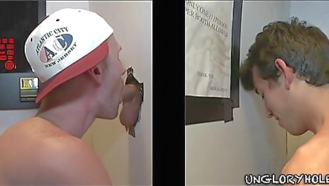 Gorgeous brunette gets a nice blowjob in the glory hole