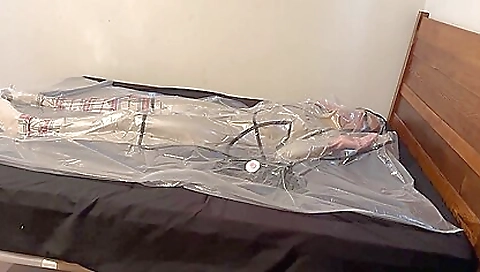 Busty bondage fetish with a sexy latex trench coat
