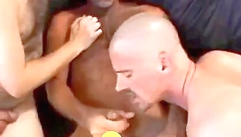 Tattooed blonde rides two men's dicks in a deepthroated way